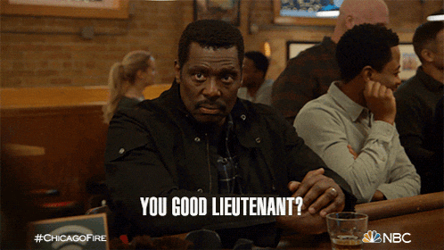 a man sitting at a bar with the words " you good lieutenant " written above him