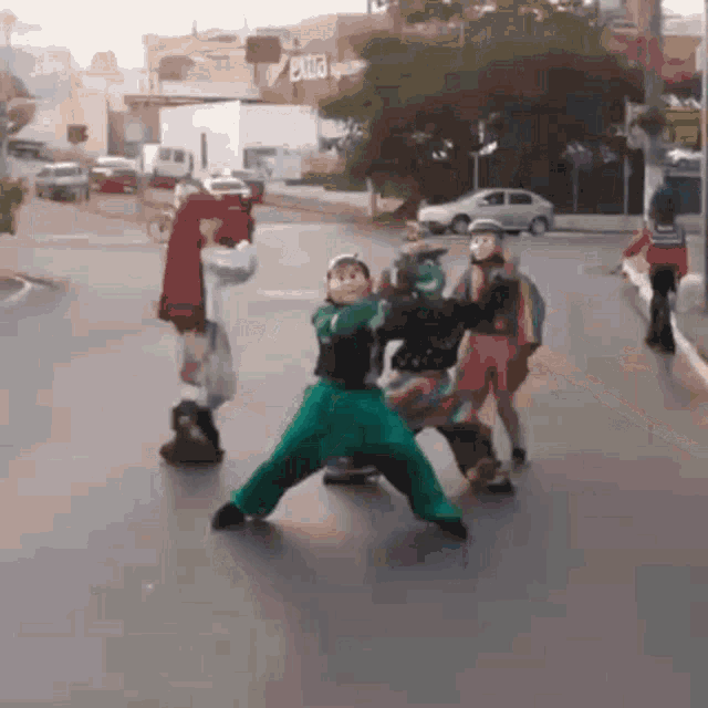 a group of children are playing on a street in front of a building that has the word exit on it
