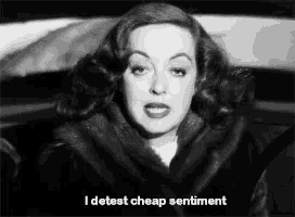 a woman in a fur coat says " i detest cheap sentiment " in a black and white photo