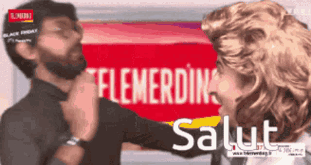 a man and a woman are standing in front of a sign that says telemerdin salut