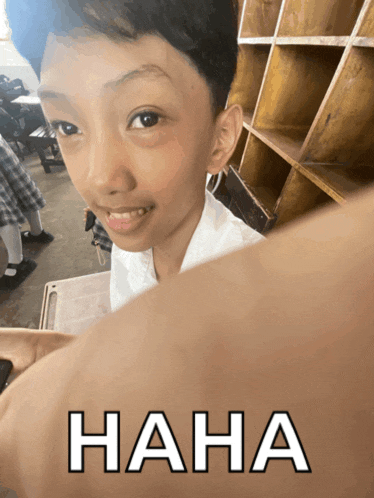 a picture of a young boy with the word haha on the bottom