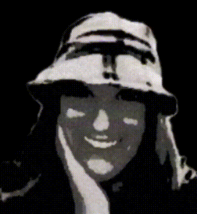 a black and white photo of a person wearing a hat