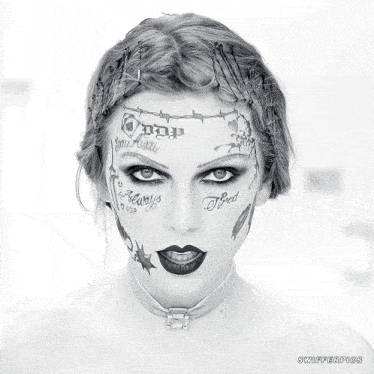 a woman with a lot of tattoos on her face including one that says " tired "