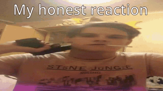 a man in a stone jungle shirt holds a gun to his head