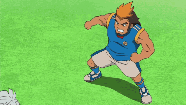 a boy in a red shirt with the number 10 on it kicks a soccer ball