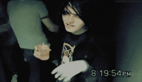 a gif of a person holding cotton candy and the time of 18:54 pm