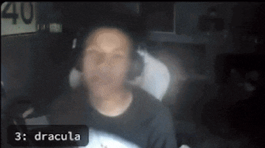 a blurry picture of a man with the words 3 dracula on the bottom right