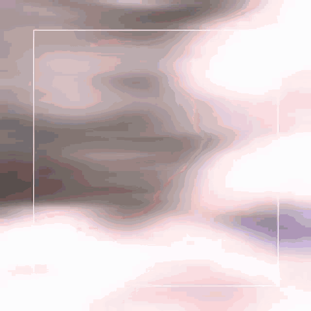 a blurred background with a white frame in the middle of it