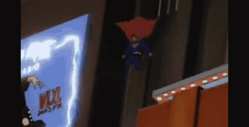 a cartoon of superman is flying through the air in front of a sign that says wxyz .