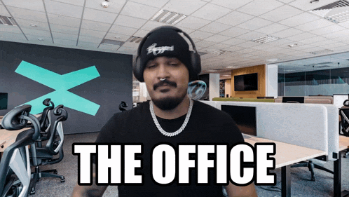 a man wearing headphones says the office