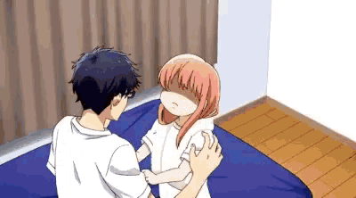 a man and a girl are sitting on a bed . the girl is covering her face with her hand .