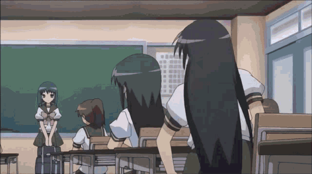 a girl with long black hair is standing in a classroom