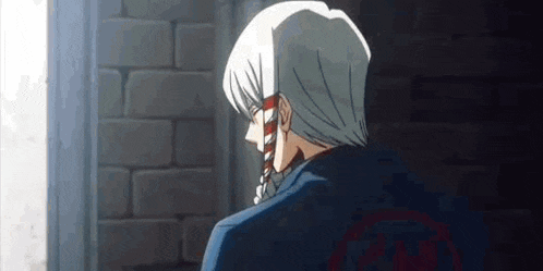a man with white hair is standing in front of a brick wall and looking out the window .