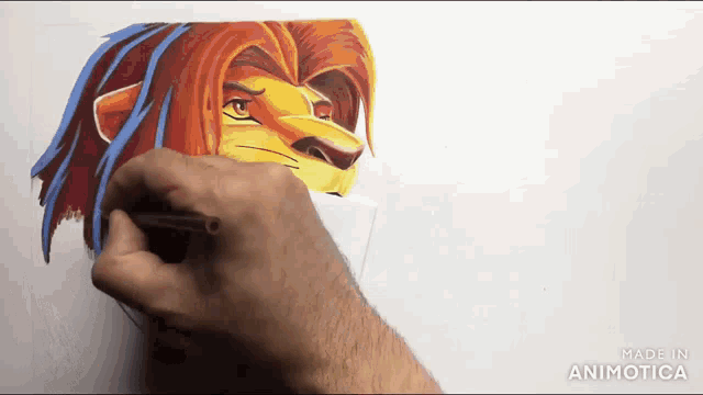 a person is drawing a picture of a lion on a piece of paper ..