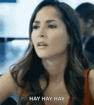 a close up of a woman 's face with the words hay hay hay on it .