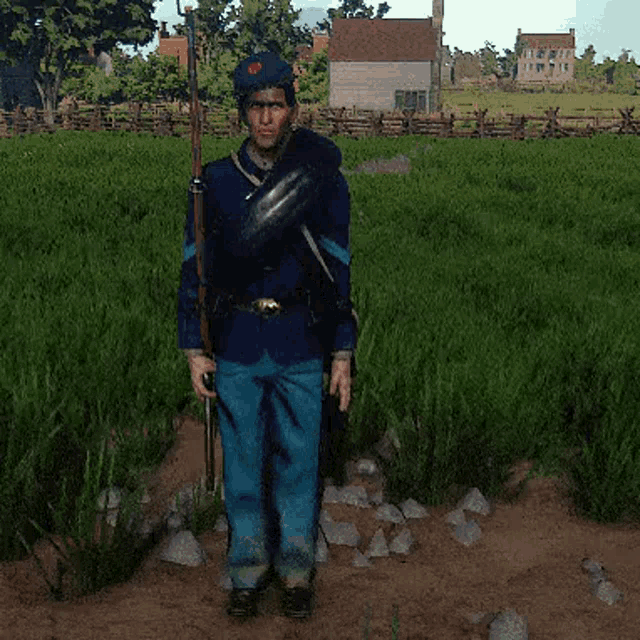 a man in a blue uniform is standing in a field holding a rifle
