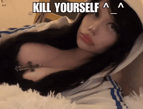 a woman in a hoodie with a cross around her neck says " kill yourself "