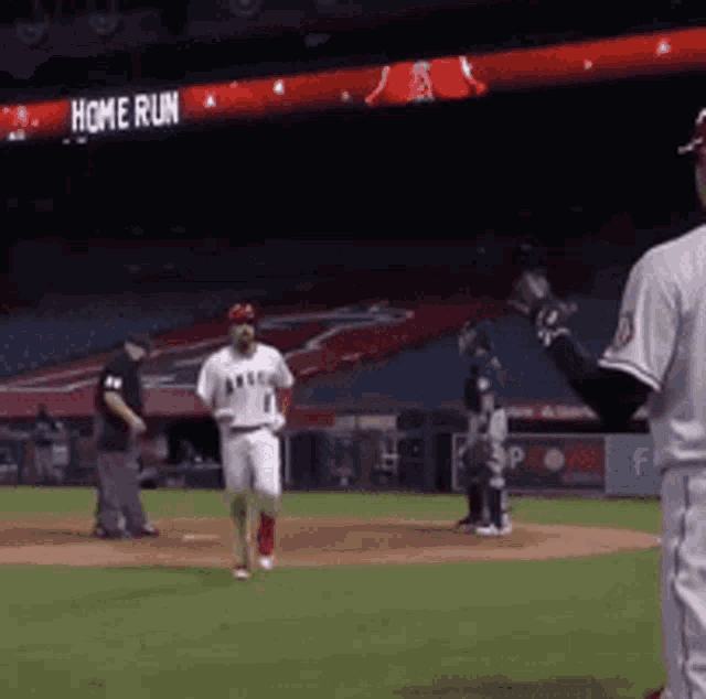 a baseball game is underway and the home run sign is visible