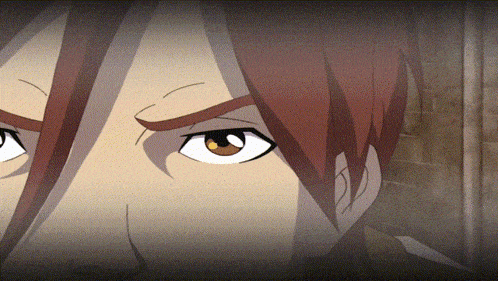 a close up of a person 's face with red hair and brown eyes