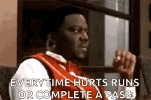 a man in a suit and tie is sitting on a couch and says `` everytime hurts runs or complete a pass ''