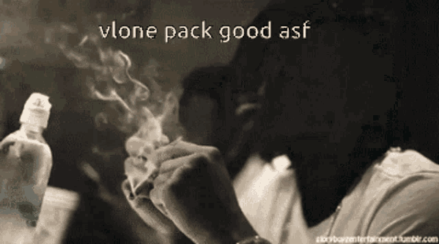a man is smoking a cigarette with the words vlone pack good asf above him
