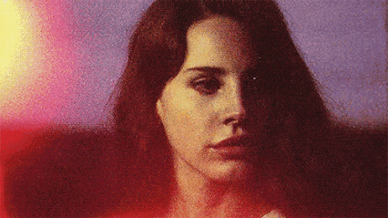 a close up of a woman 's face with a blurred background