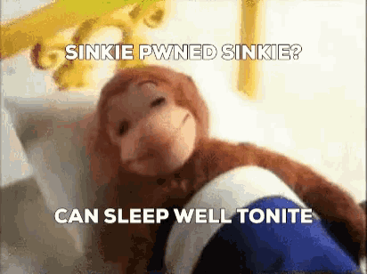 a stuffed monkey is laying in a bed with the words " can sleep well tonite " written below it