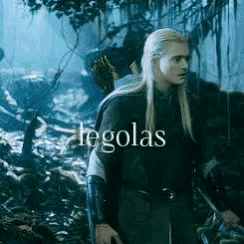 a man with long blonde hair is standing in the woods with the word legolas written on the bottom