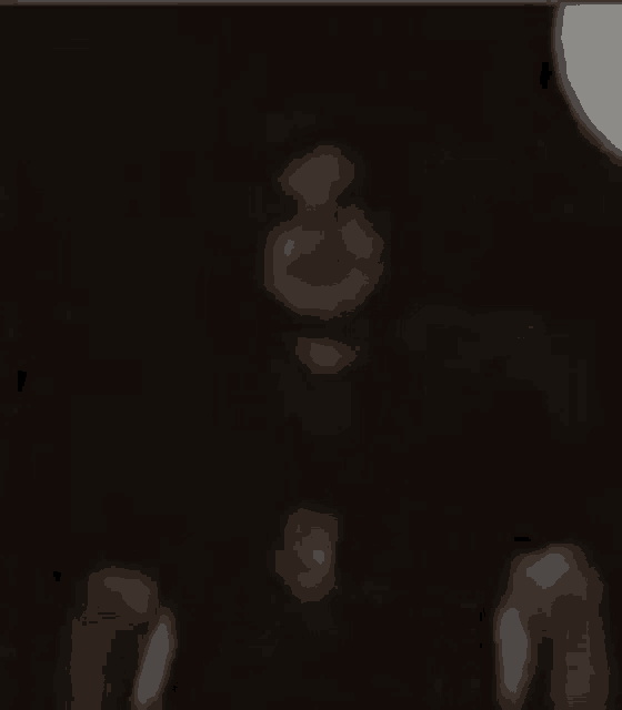 a blurred image of a person in a dark room .