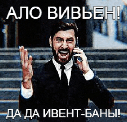 a man in a suit and tie is talking on a cell phone in a foreign language .