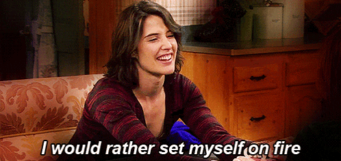 a woman sitting on a couch with the words " i would rather set myself on fire " above her