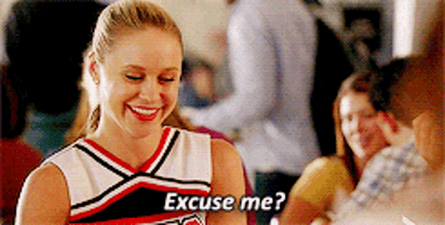 a cheerleader says excuse me in front of a group of people