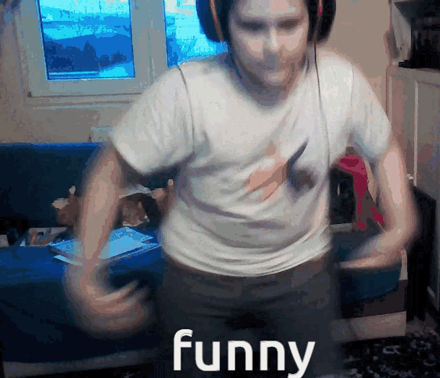 a man wearing headphones and a white shirt that says funny on it