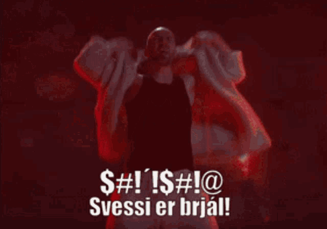 a man is holding a firework display with the words $ # ! ! $ # ! @ svessi er brajl