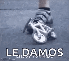 a person is wearing roller skates and riding a small bicycle .