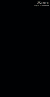 a woman in a green shirt is standing in front of lightning