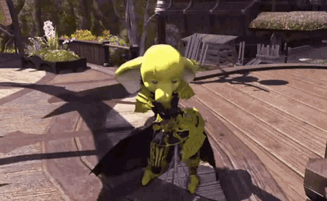 a yellow monster is standing on a wooden deck holding a sword .