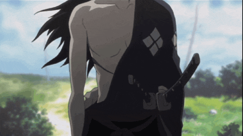 a man without a shirt is holding a sword in his belt
