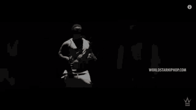 a group of men are standing in front of a wall with the words listen to new tracks