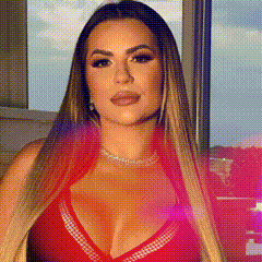 a woman with long hair is wearing a red bikini top and a necklace .