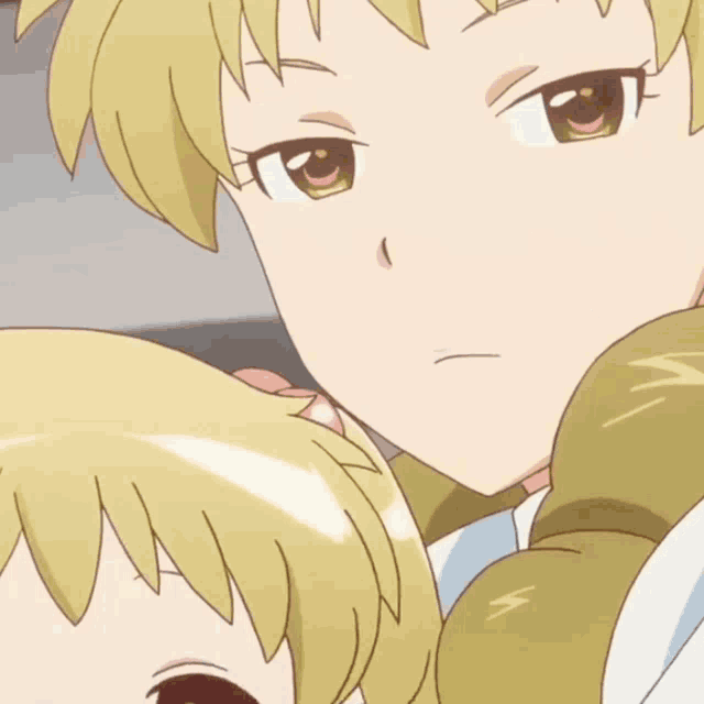 a close up of a cartoon girl 's face with a serious look on her face