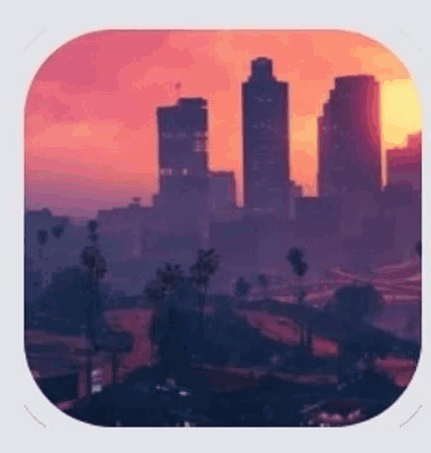a sunset over a city with a lot of buildings and trees