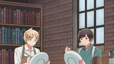 two anime characters are looking at a plate with a circle in the middle