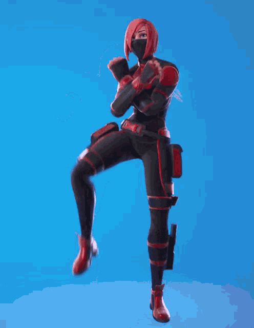 a woman in a red and black superhero costume is standing on one leg