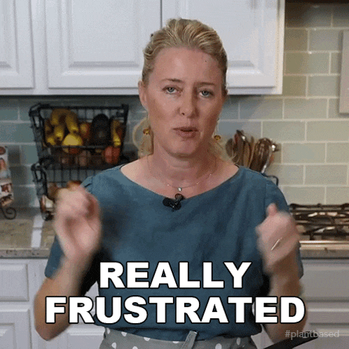 a woman in a blue shirt says really frustrated