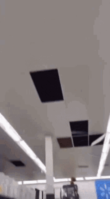 a blurred image of a person walking in a room