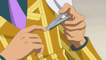 a man in a yellow suit is cutting his nails with a pair of nail clippers