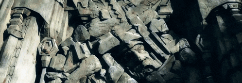a painting of a rocky cliff with the letter t on the bottom