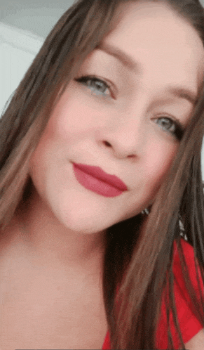 a close up of a woman 's face with red lips