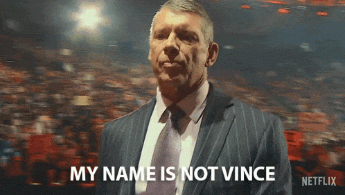 a man in a suit and tie says " my name is not vince " in front of a crowd